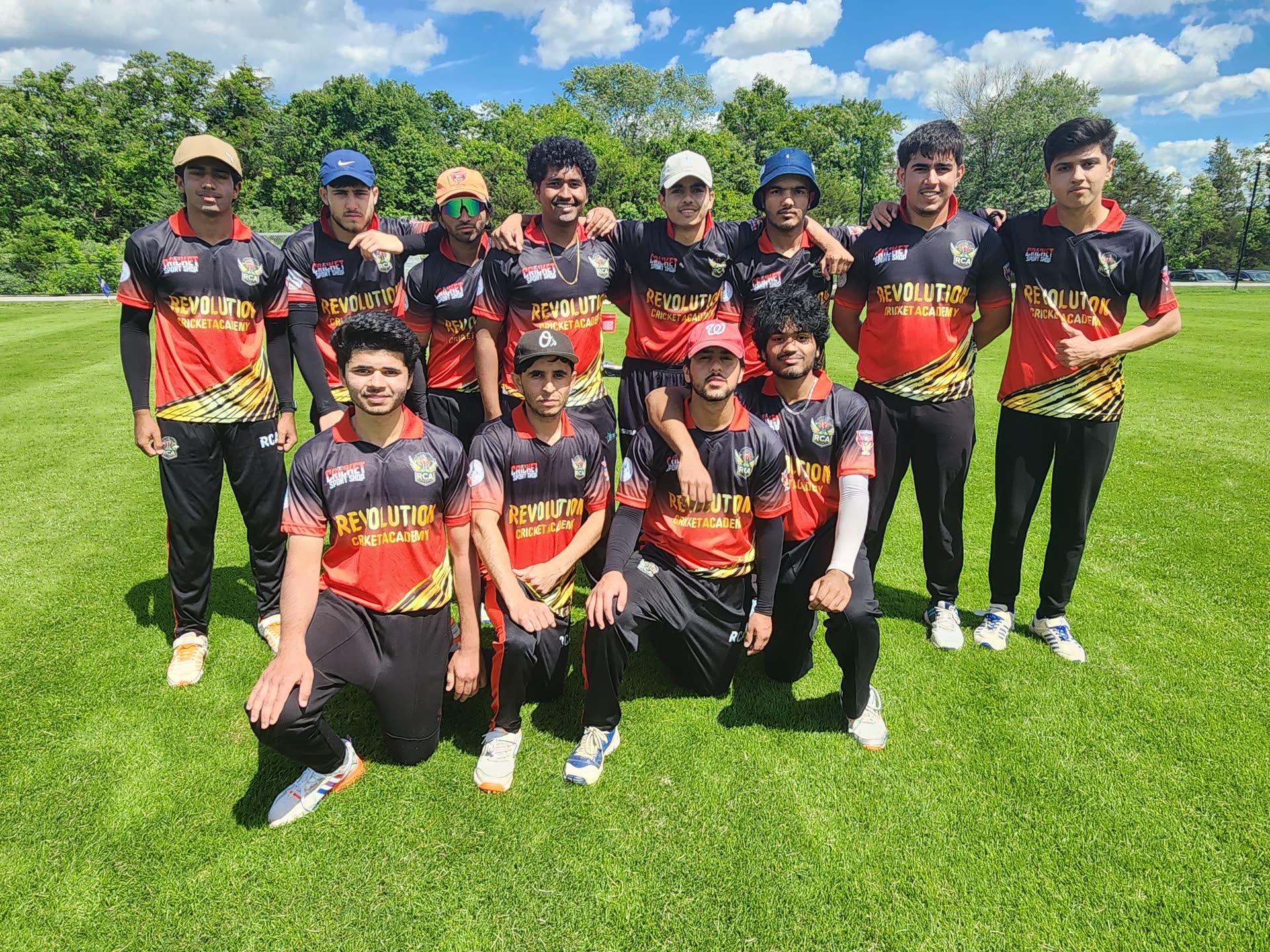 Revolution Cricket Academy U19 squad in academy kit on the field before a tournament match